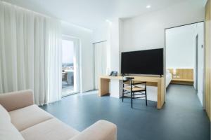 TV a/nebo společenská místnost v ubytování Felix Hotels - Hotel Felix Olbia