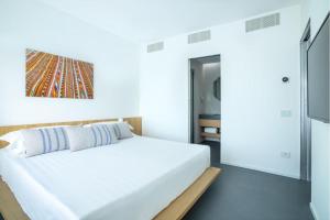 Postel nebo postele na pokoji v ubytování Felix Hotels - Hotel Felix Olbia