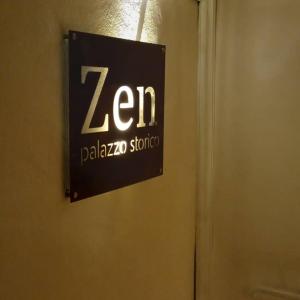 a sign on a door with a zebra sign on it at Zen Guest House Olistica in Alliste