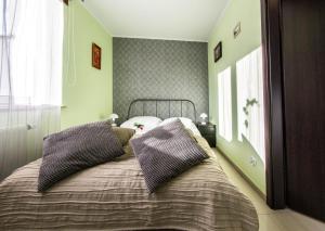 Postel nebo postele na pokoji v ubytování Apartamenty Izerskie