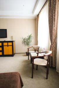 TV a/nebo společenská místnost v ubytování Georg Palace Hotel