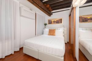 Postel nebo postele na pokoji v ubytování Spadaria San Marco Guest House