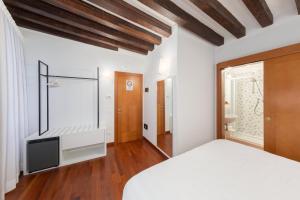 Postel nebo postele na pokoji v ubytování Spadaria San Marco Guest House
