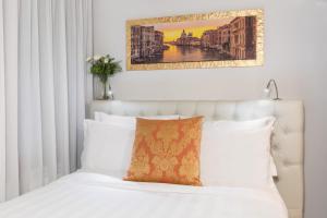 Postel nebo postele na pokoji v ubytování Spadaria San Marco Guest House