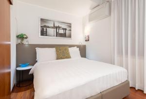 Postel nebo postele na pokoji v ubytování Spadaria San Marco Guest House