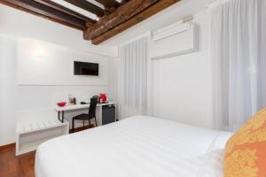 Postel nebo postele na pokoji v ubytování Spadaria San Marco Guest House