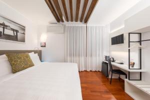 Postel nebo postele na pokoji v ubytování Spadaria San Marco Guest House