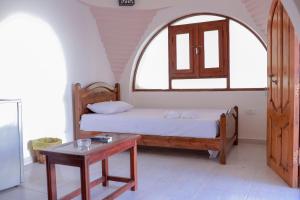 מיטה או מיטות בחדר ב-Coral Reefs Hotel Dahab