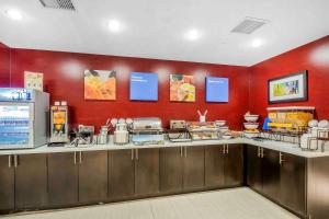 a fast food restaurant with a red wall at Comfort Inn & Suites near Stadium in Bronx