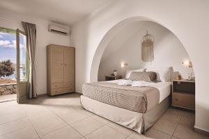 A bed or beds in a room at Noon Beyond Accommodation