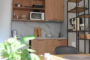 Η κουζίνα ή μικρή κουζίνα στο Feels Like Home Studio Apartments - FLH Albania