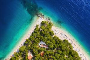 an aerial view of a tropical island in the ocean at Bluesun Hotel Marina in Brela
