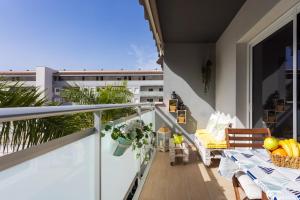 A balcony or terrace at Home2Book Stunning Apartment Bajamar