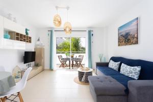 A seating area at Home2Book Stunning Apartment Bajamar