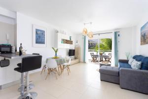 A kitchen or kitchenette at Home2Book Stunning Apartment Bajamar