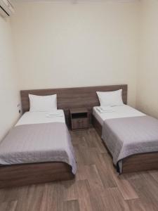 Postel nebo postele na pokoji v ubytování Prometey Hotel