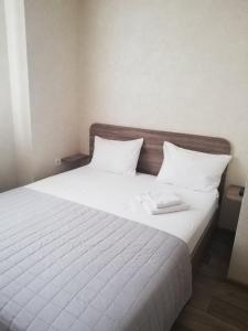 Postel nebo postele na pokoji v ubytování Prometey Hotel