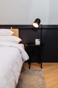 Postel nebo postele na pokoji v ubytování Alice Hotel