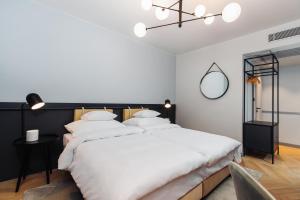 Postel nebo postele na pokoji v ubytování Alice Hotel