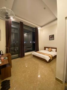 Postel nebo postele na pokoji v ubytování An Nhien Hotel