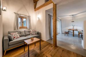 a living room with a couch and a table at Wastleicherhof in Eggstätt