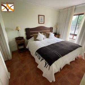 Postel nebo postele na pokoji v ubytování Hotel del Volcán