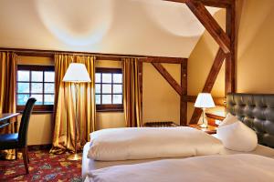 Cama ou camas em um quarto em Residenz Hotel Wendorf