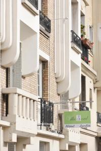 a sign on the side of a building with balconies at Hôtel Villa Sorel - Paris Boulogne in Boulogne-Billancourt