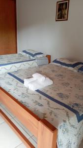 Postel nebo postele na pokoji v ubytování Pouso Vovó Laurinda