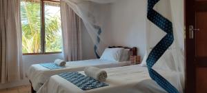 Cama ou camas em um quarto em Bay View Lodge