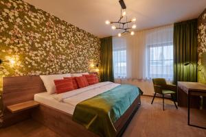 Postel nebo postele na pokoji v ubytování Hotel Alfréd a Hermína