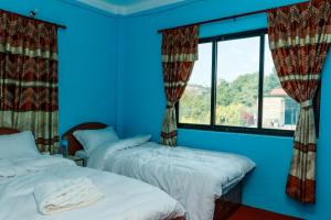 Postel nebo postele na pokoji v ubytování Nagarkot Nayagaun Homestay