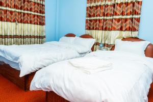 Postel nebo postele na pokoji v ubytování Nagarkot Nayagaun Homestay