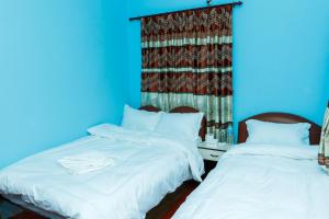 Postel nebo postele na pokoji v ubytování Nagarkot Nayagaun Homestay
