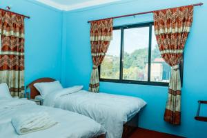 Postel nebo postele na pokoji v ubytování Nagarkot Nayagaun Homestay