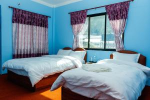 Llit o llits en una habitació de Nagarkot Nayagaun Homestay