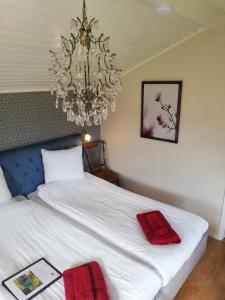 Postel nebo postele na pokoji v ubytování Karlsberg Gård B&B + 37 fotografií