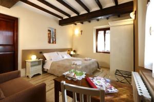 Postel nebo postele na pokoji v ubytování B&B Le Noci di Feo