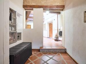 a hallway of a house with a brick floor at La Casa del Lirón by Toledo AP in Toledo