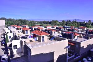 an aerial view of a city with white buildings at Essy's Furnished Homes Nakuru with pool & GYM in Nakuru