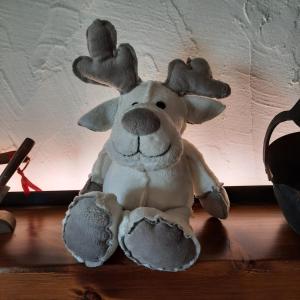 a stuffed moose sitting on top of a table at Casa Orsola - Your Mountain Holiday in Premana