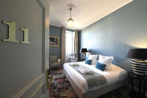 Postel nebo postele na pokoji v ubytování Grand Hôtel Henri - Teritoria