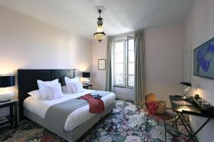 Postel nebo postele na pokoji v ubytování Grand Hôtel Henri - Teritoria