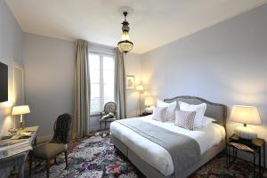 Postel nebo postele na pokoji v ubytování Grand Hôtel Henri - Teritoria