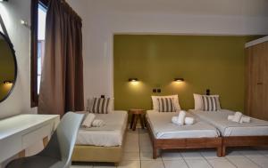Postel nebo postele na pokoji v ubytování Iraklis Apartments