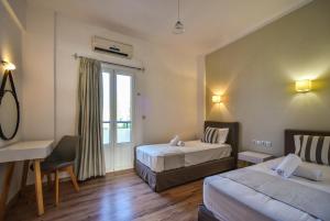 Postel nebo postele na pokoji v ubytování Iraklis Apartments