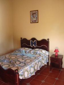 En eller flere senge i et værelse på Ecolodge Blue Morpho