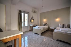 Postel nebo postele na pokoji v ubytování Iraklis Apartments