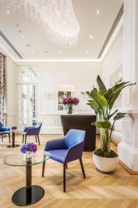 Uma área de estar em Hotel Polonia Palace