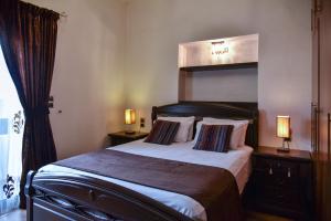 Postel nebo postele na pokoji v ubytování Iraklis Apartments